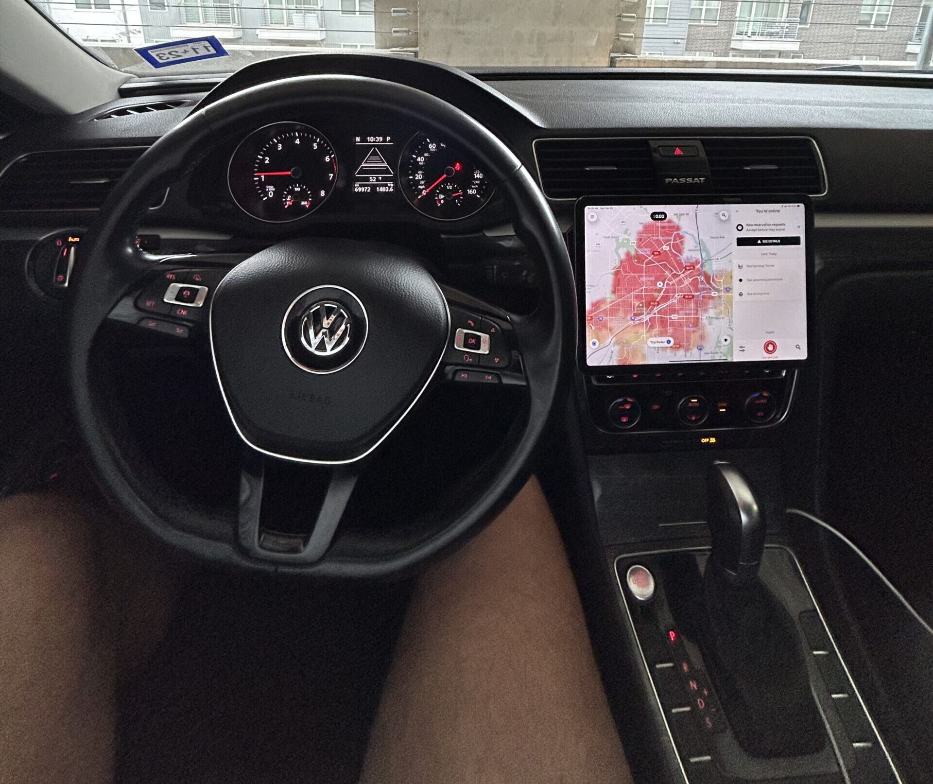 iPad mounted in car dashboard showing CarPlay setup