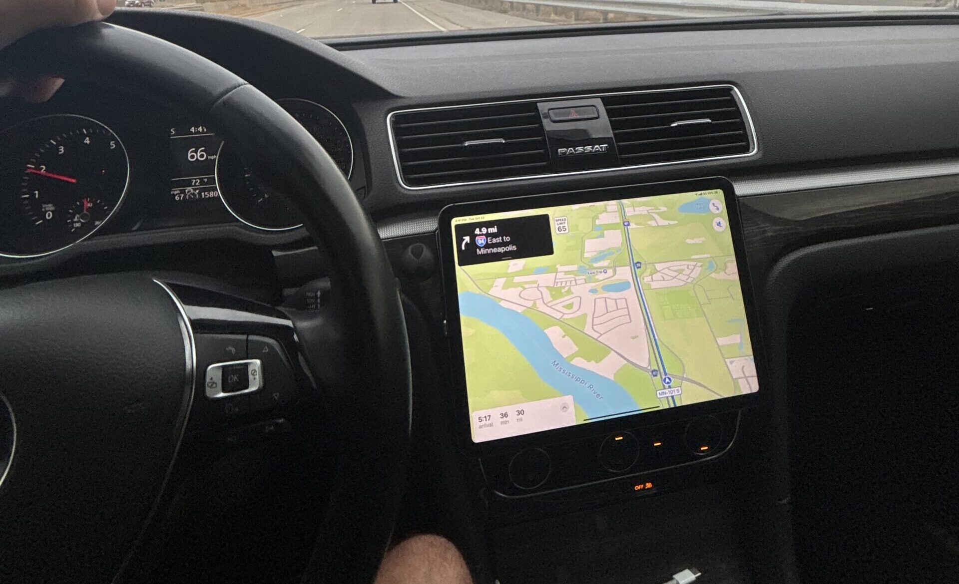 iPad mounted in car dashboard showing CarPlay setup